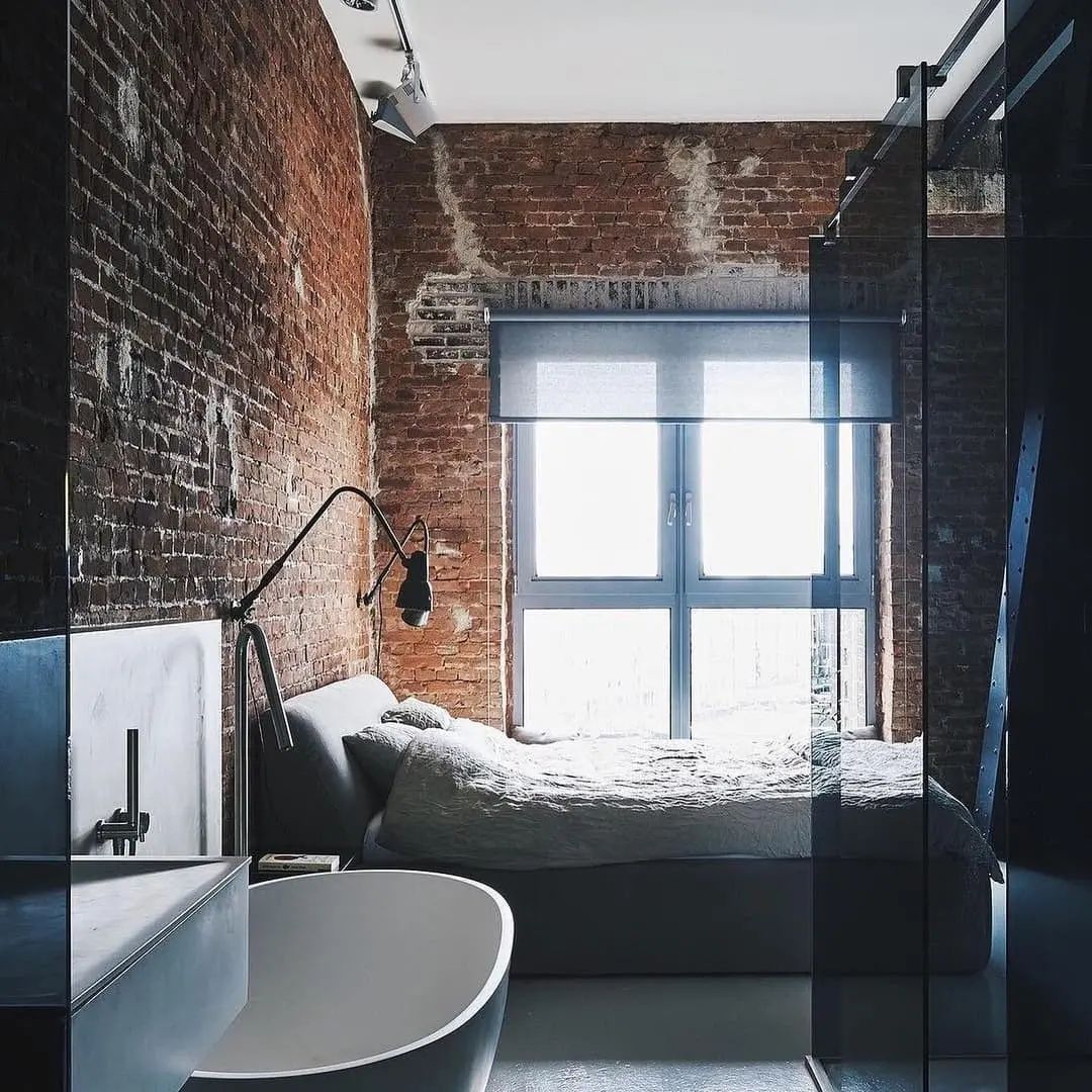 A chic urban loft space with exposed brickwork and a fusion of modern and industrial elements