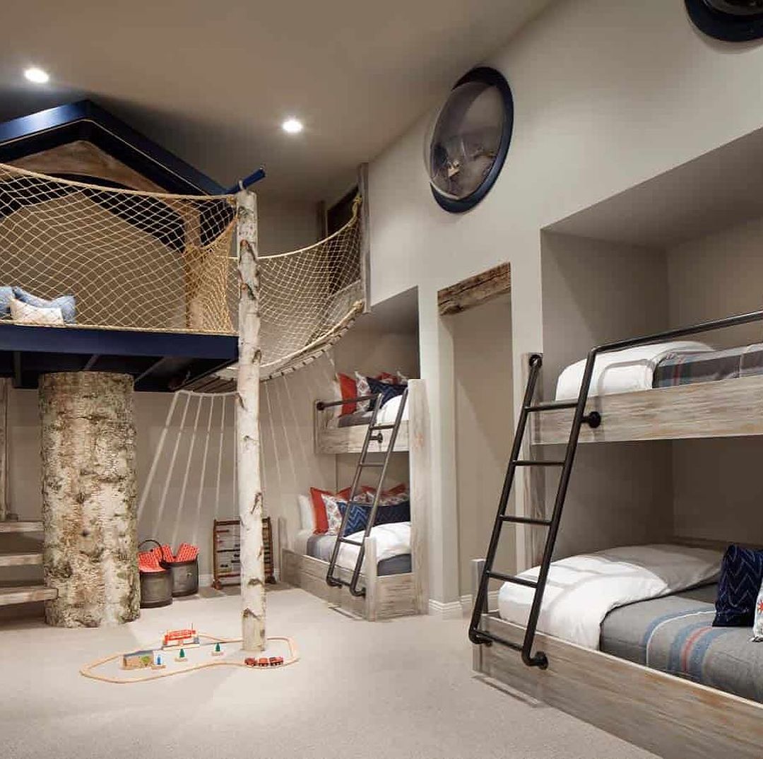 A whimsically designed kids' room with bunk beds and a nautical theme