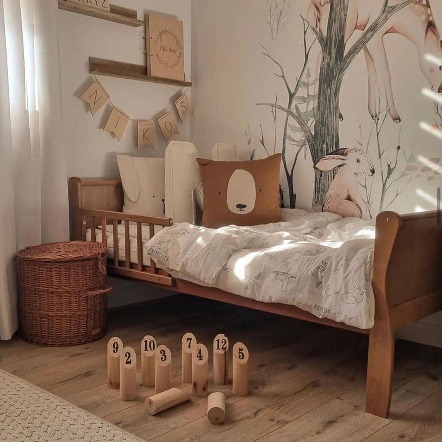 A cozy and imaginative children's bedroom with a woodland theme