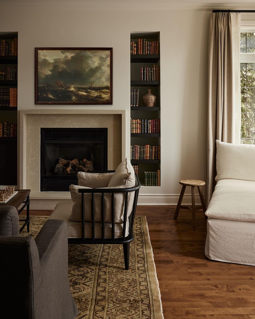 A cozy and classic living room with a fireplace