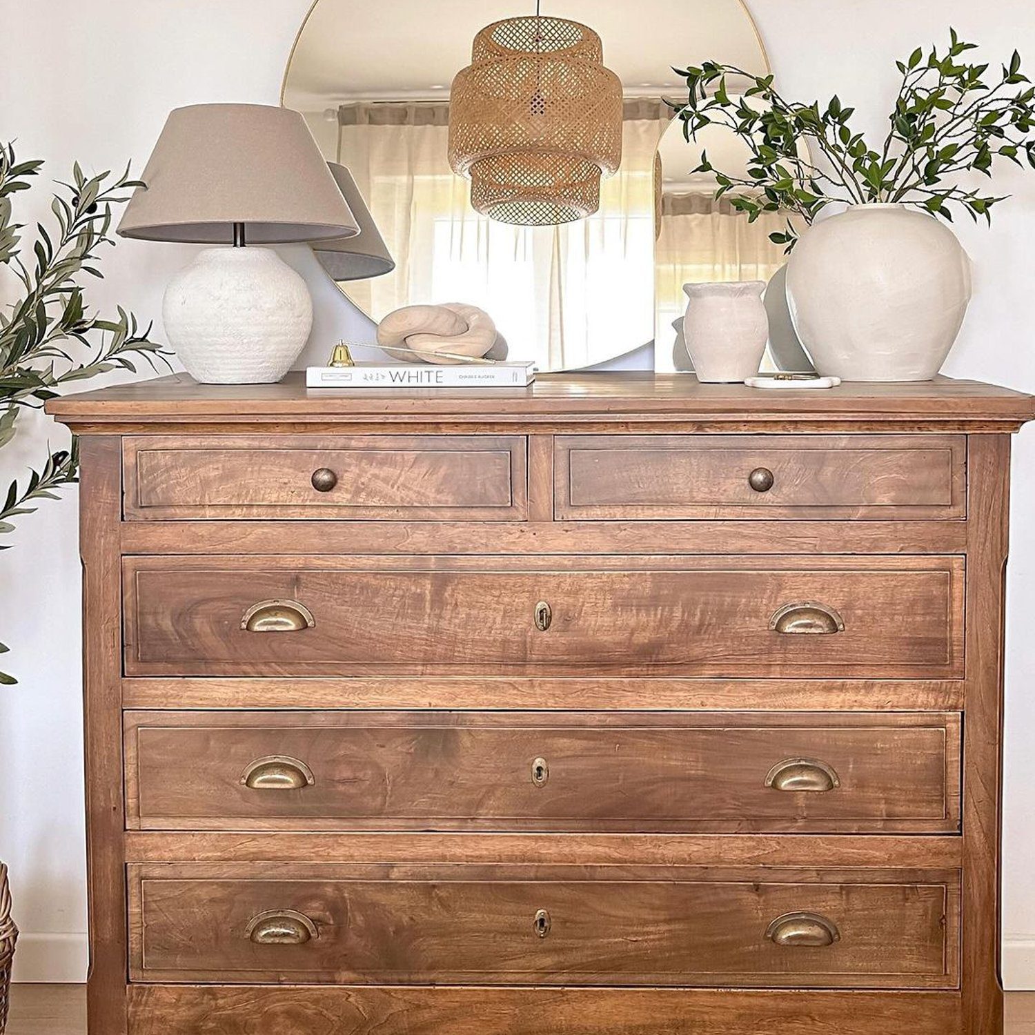 Elegant wooden dresser in a cozy interior