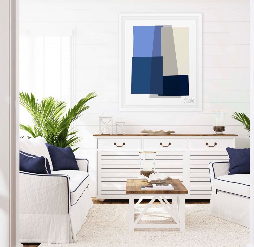 Coastal inspired living space with white and navy blue accents