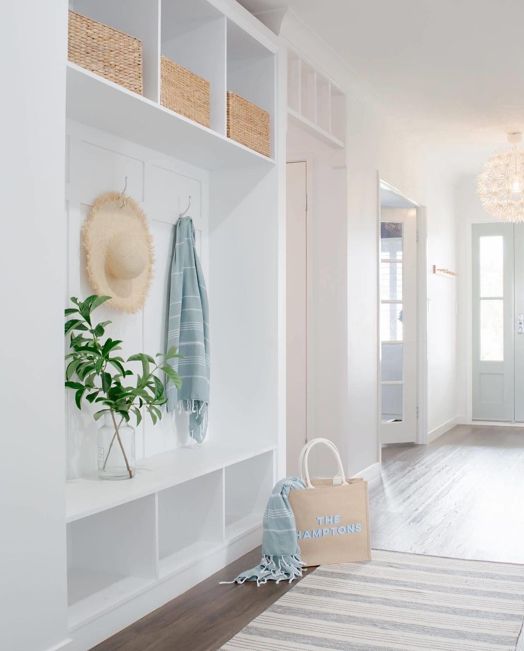 Coastal-style entryway with functional storage and decor