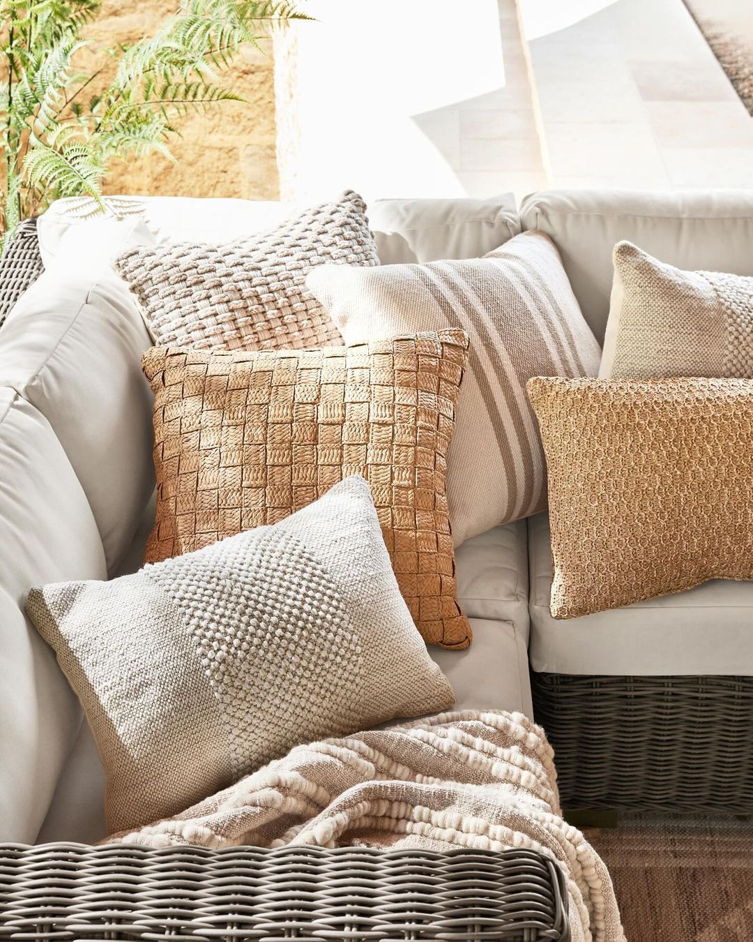 Cozy and textured throw pillows on a sofa