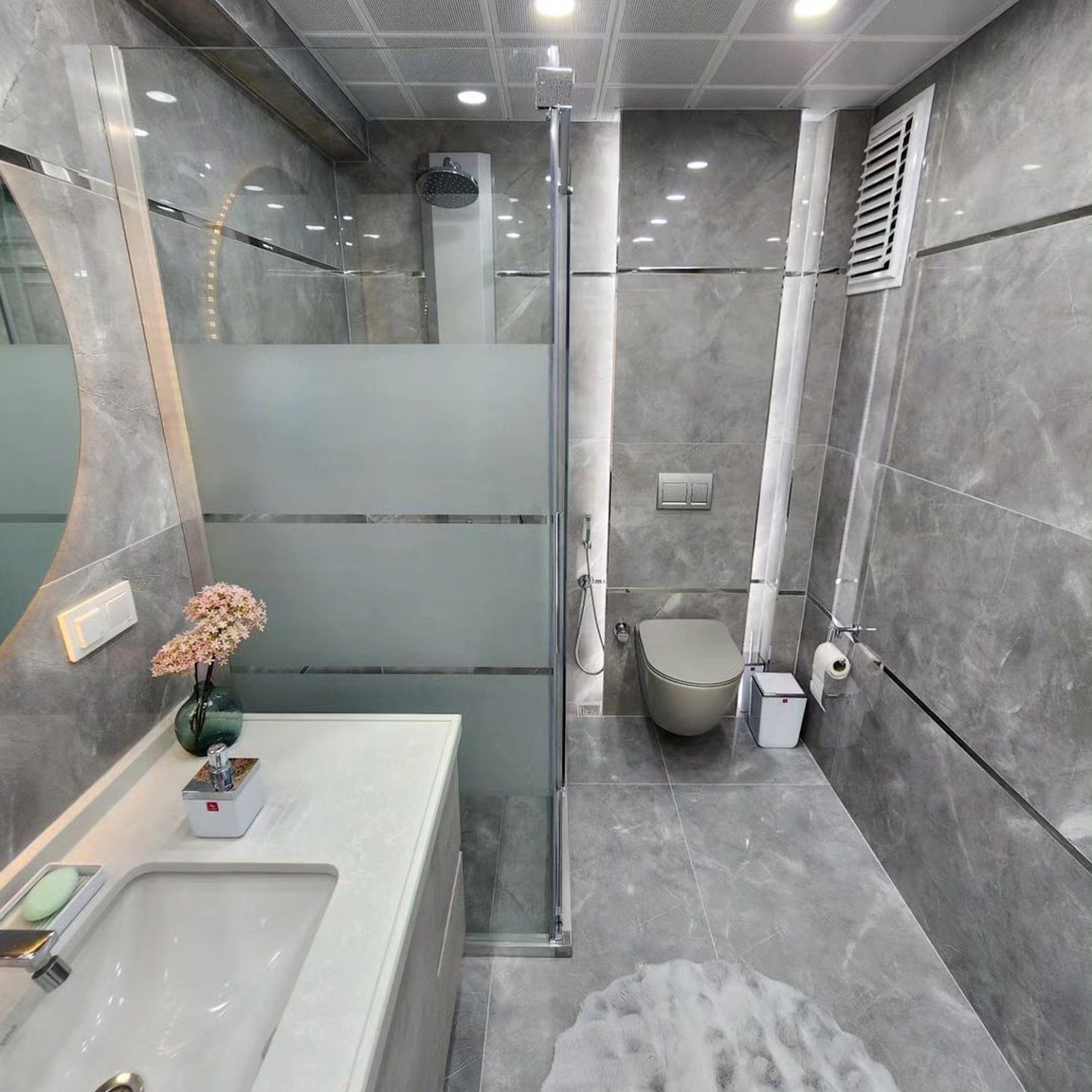 A modern and stylish bathroom with gray tiles