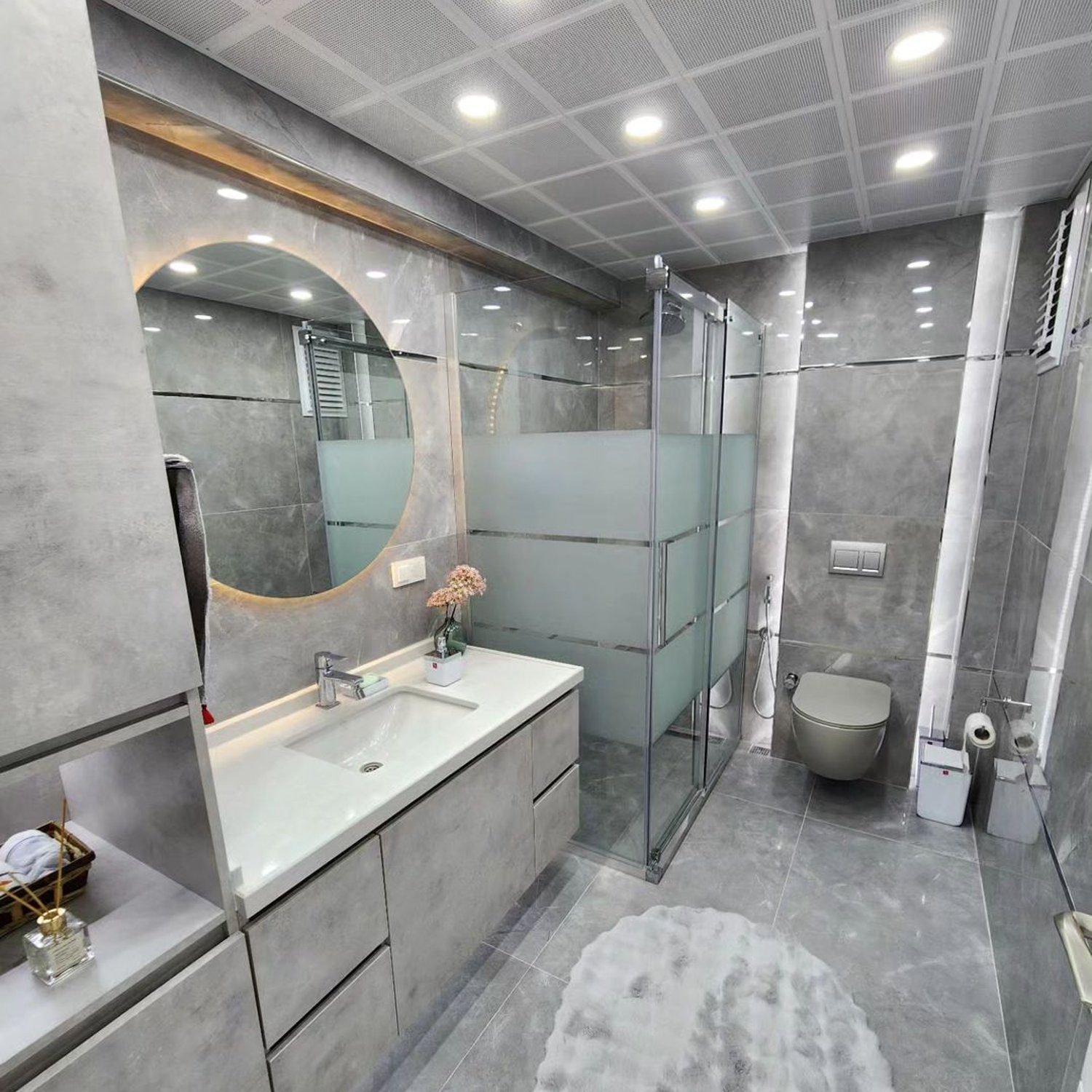 Modern designed bathroom with cohesive gray tones