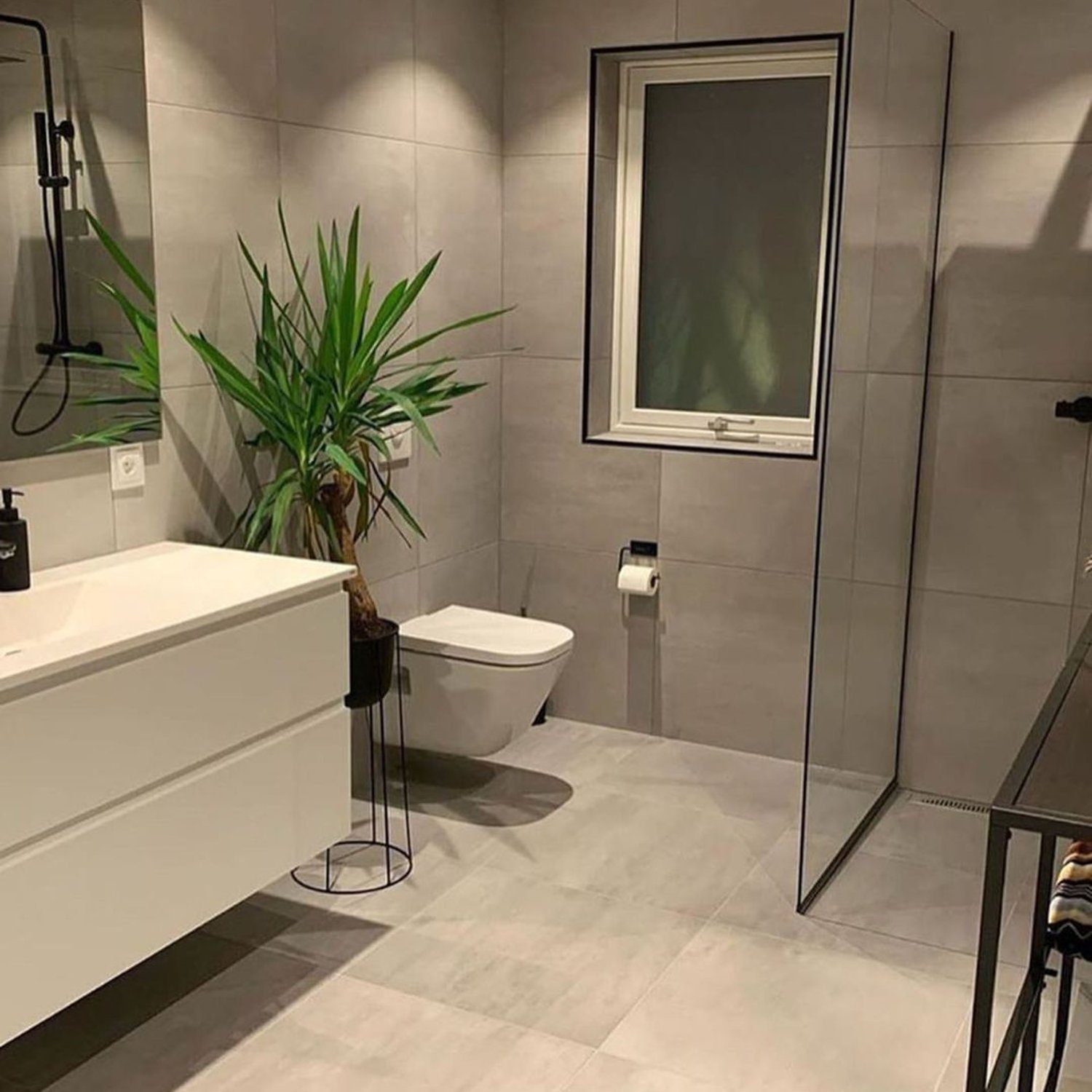 Stylish grey bathroom with modern fixtures