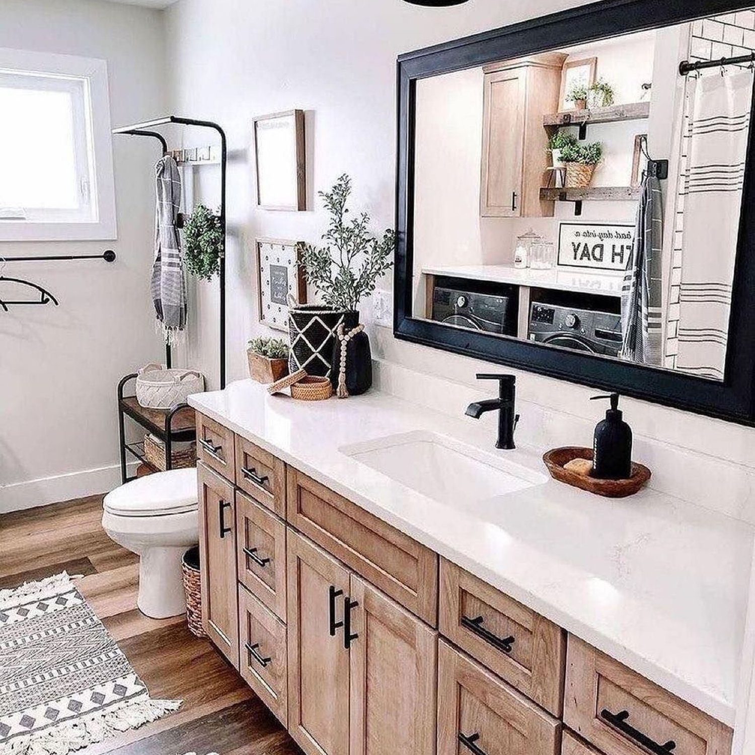 A modern bathroom with wooden cabinetry and neutral tones