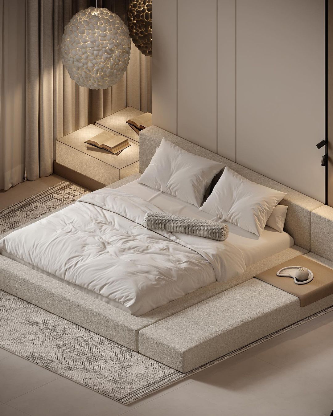 A modern and serene bedroom design featuring a built-in platform bed with neutral-tone textiles