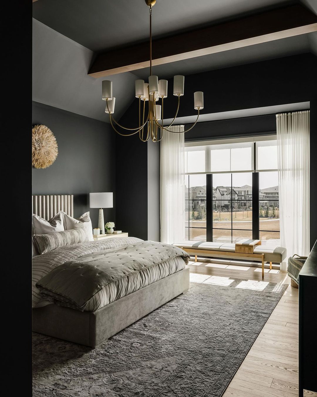 A modern and sophisticated bedroom decor with a statement chandelier