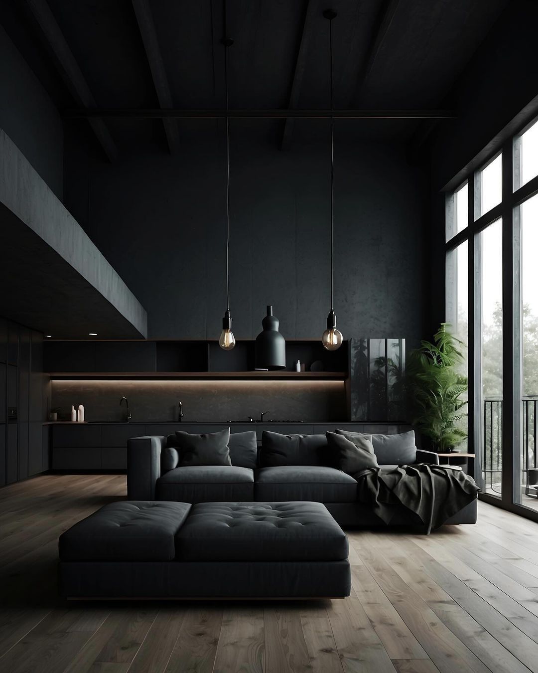 A modern and moody kitchen lounge area with deep-toned furniture and ambient lighting.