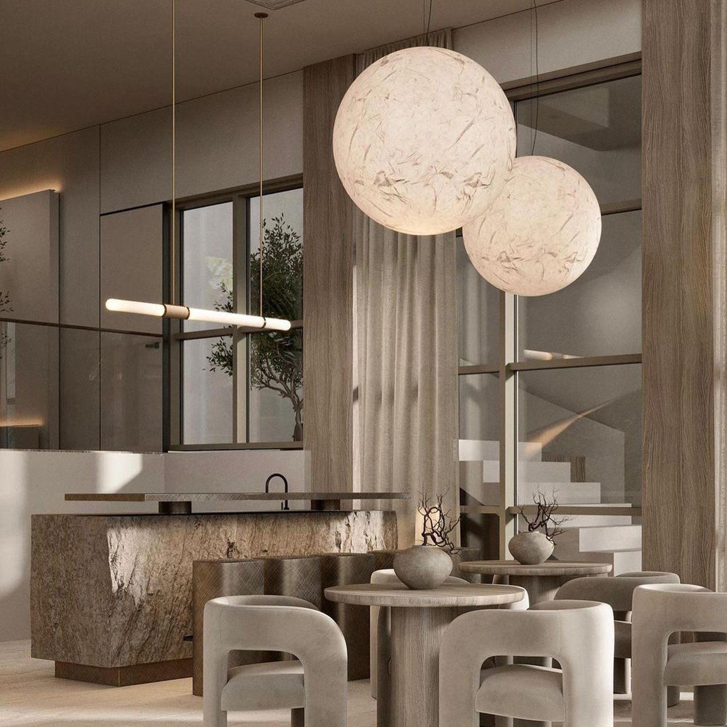 Elegant and modern kitchen featuring raw textures and spherical lighting