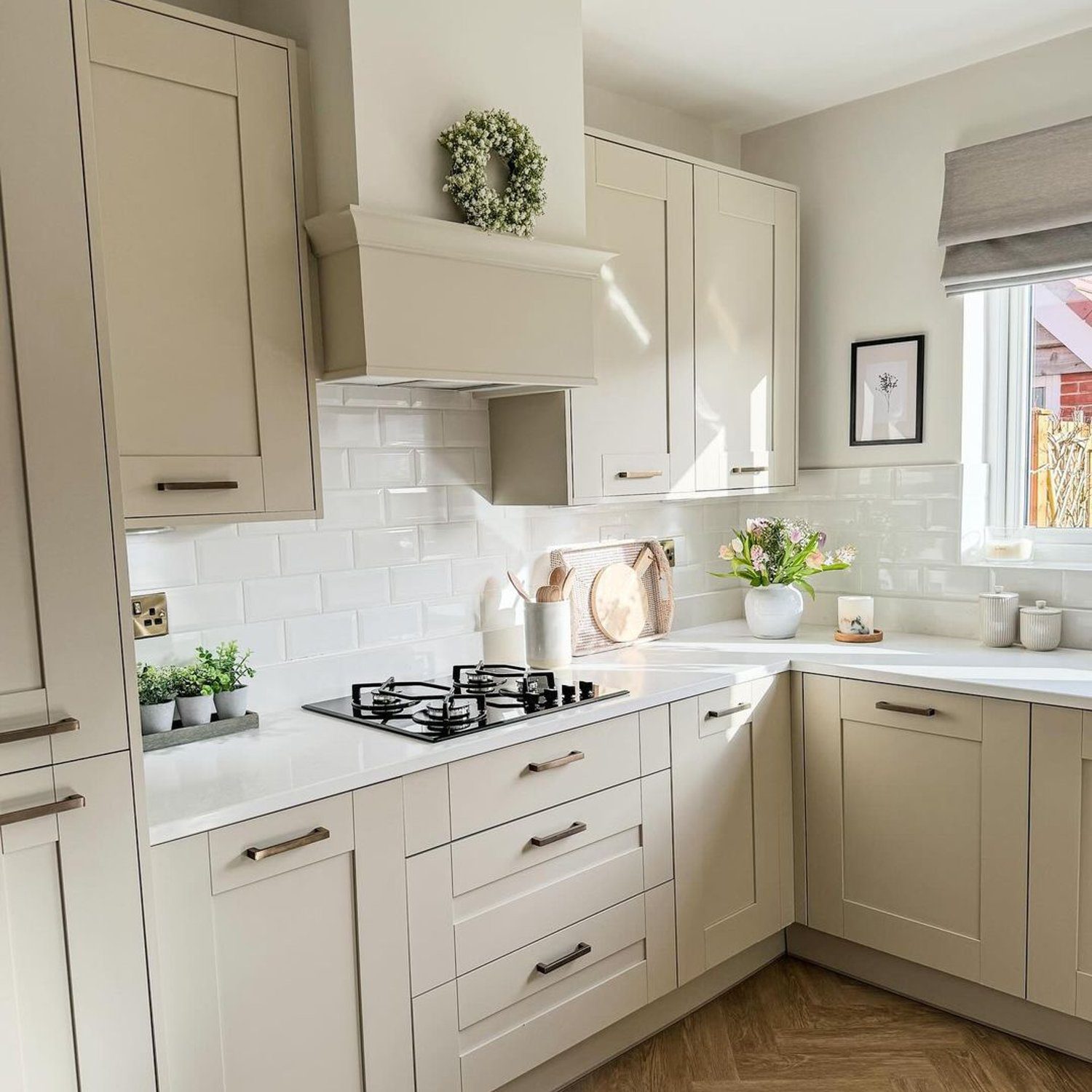 A modern, well-organized kitchen space featuring neutral tones and sleek design.