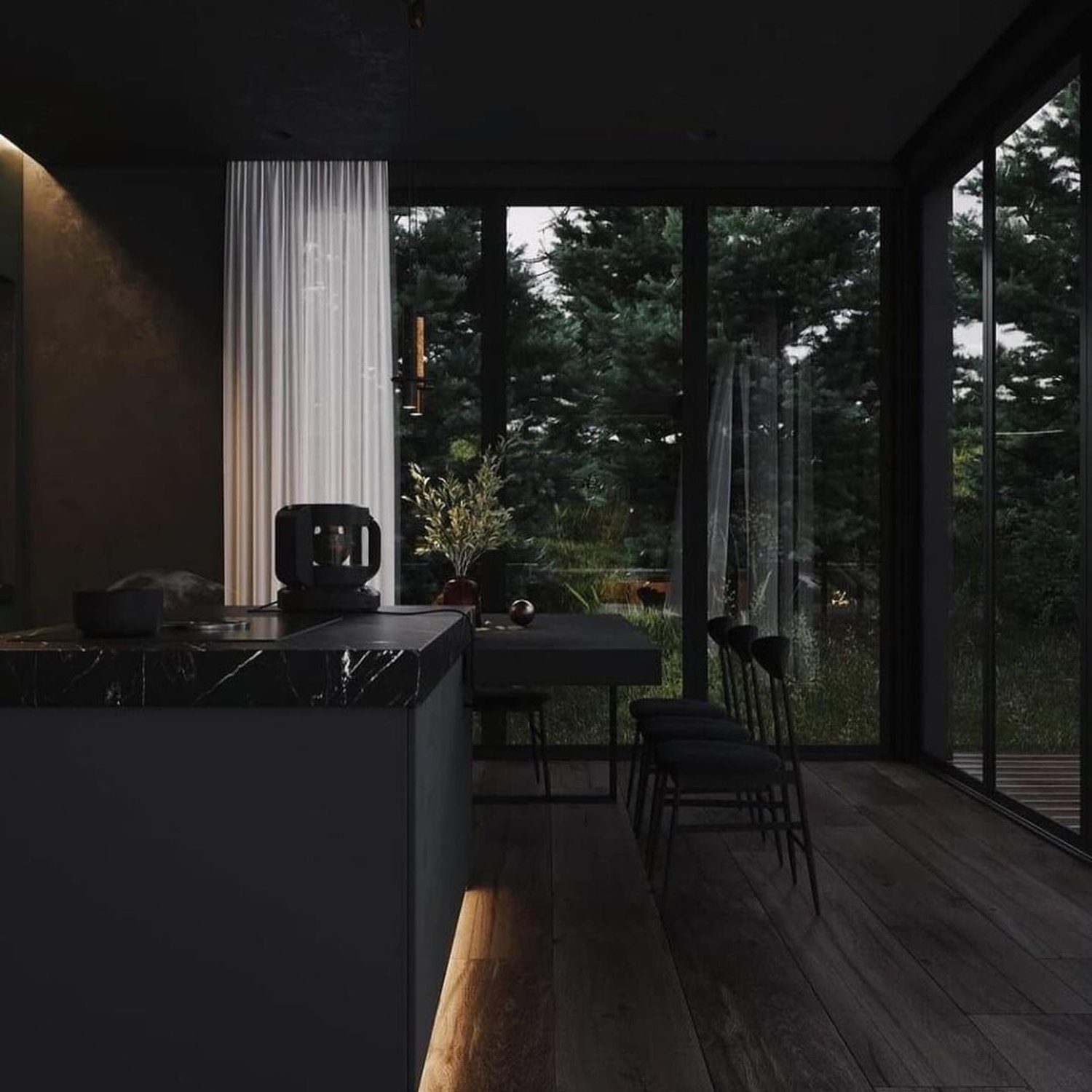 A modern kitchen with a serene forest view