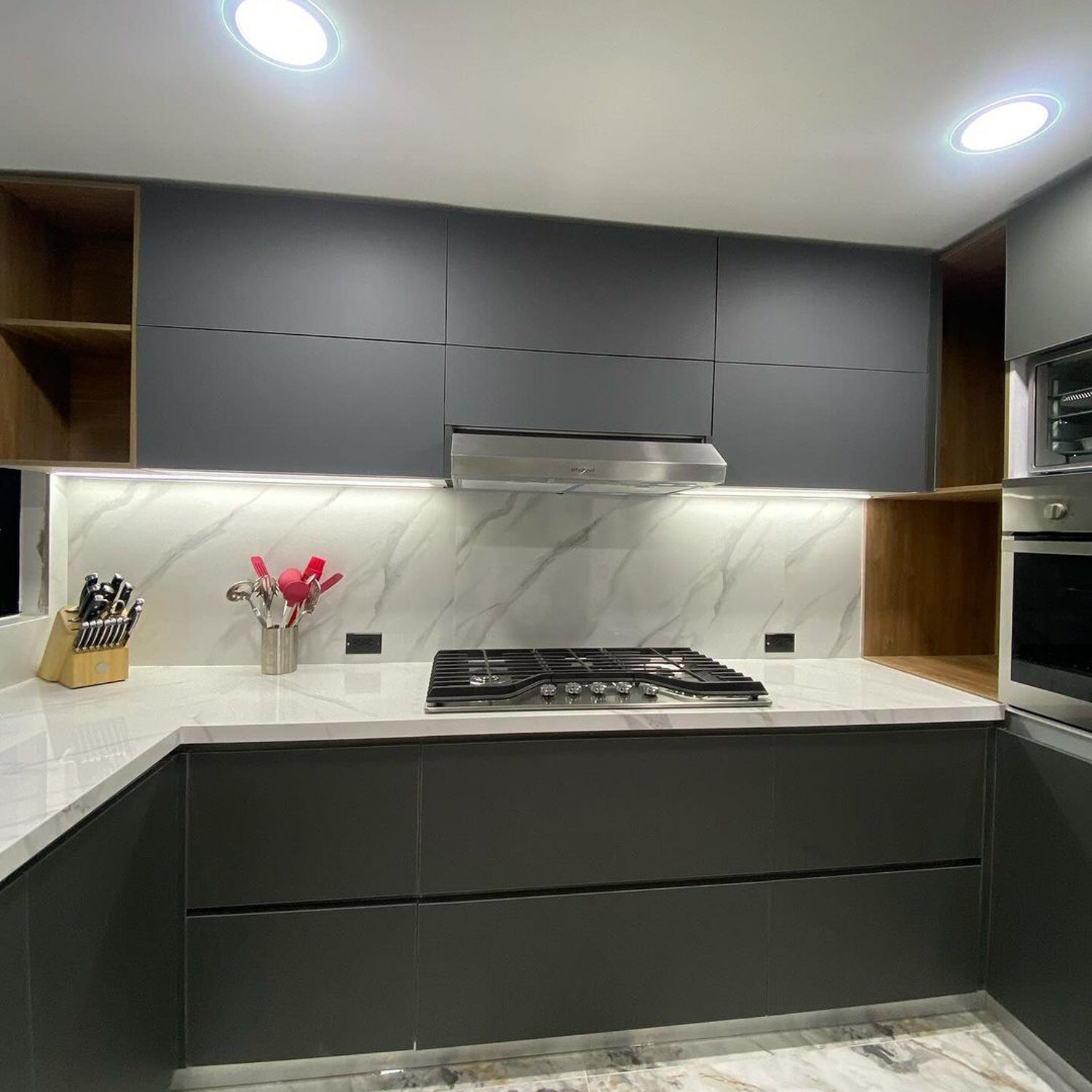 Contemporary kitchen with sleek gray cabinetry