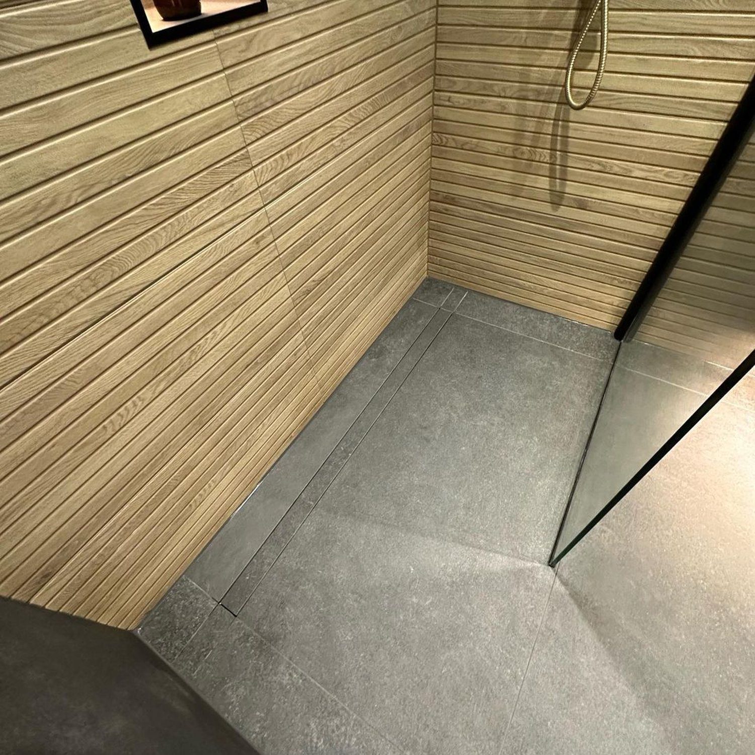 A modern shower space with textured tiles