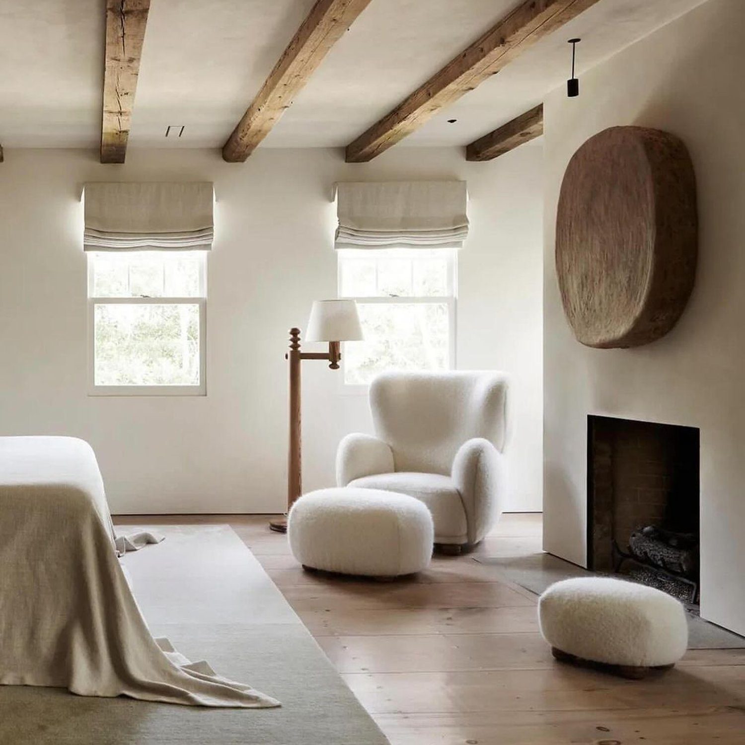 Cozy minimalist living room with exposed wooden beams