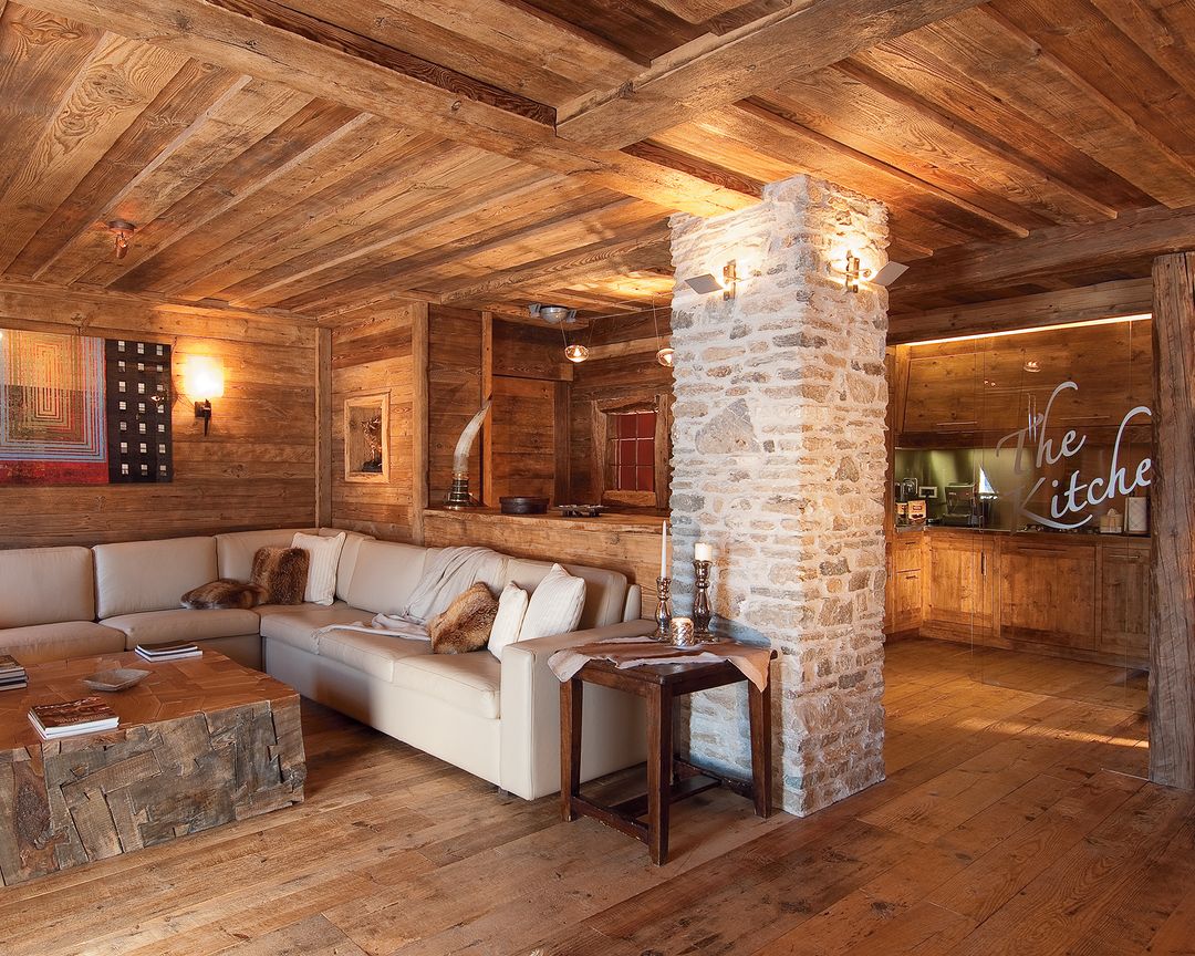 Rustic mountain chalet living room with stone column