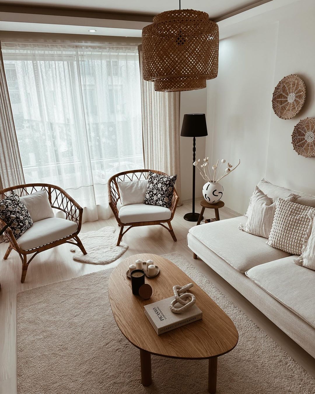 A cozy and stylish living room with natural light filtering through sheer curtains