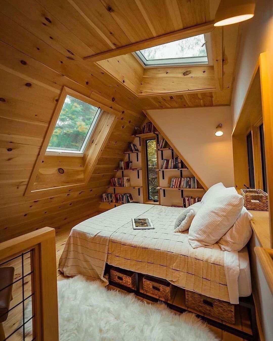 Cozy attic bedroom with bookshelves