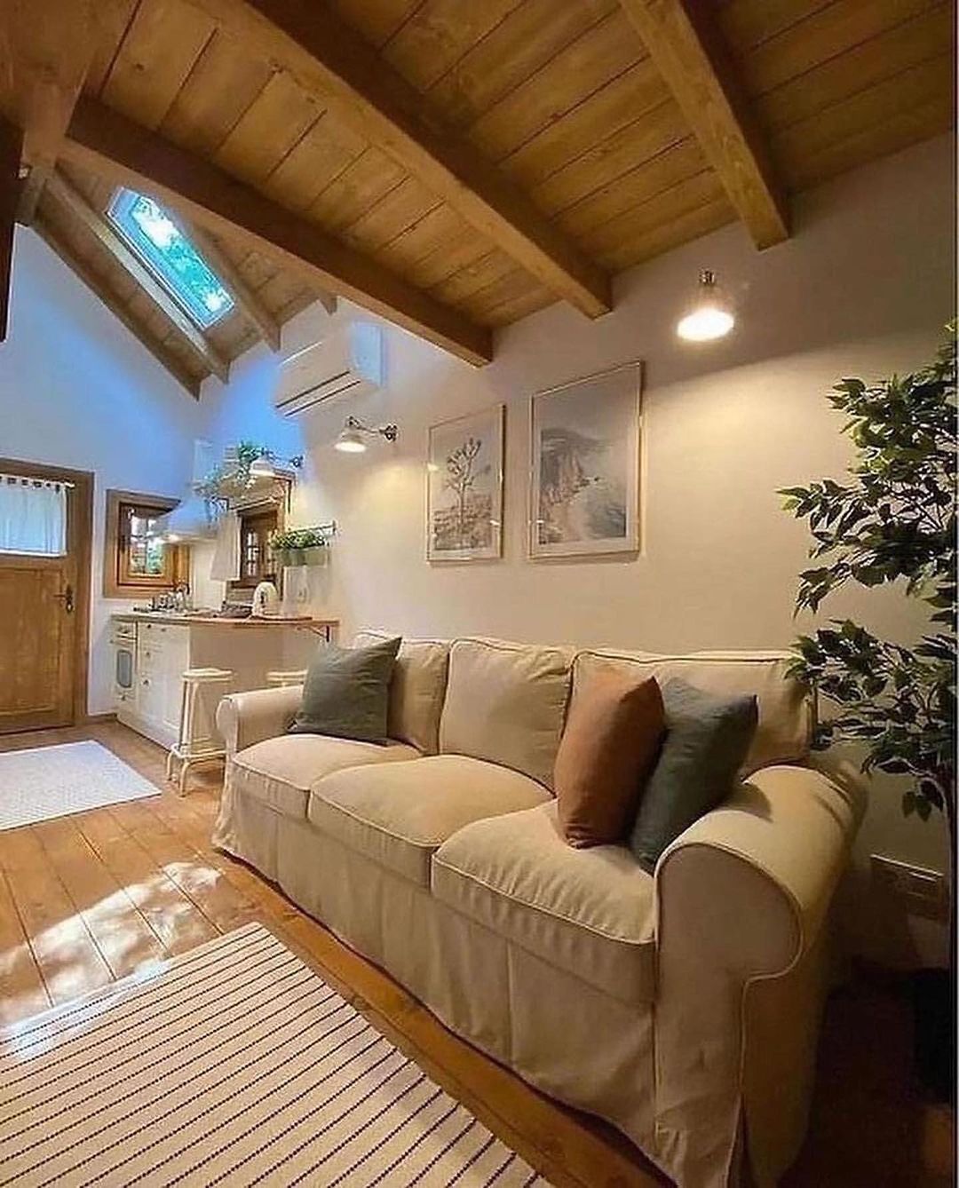 Cozy attic living room with skylight