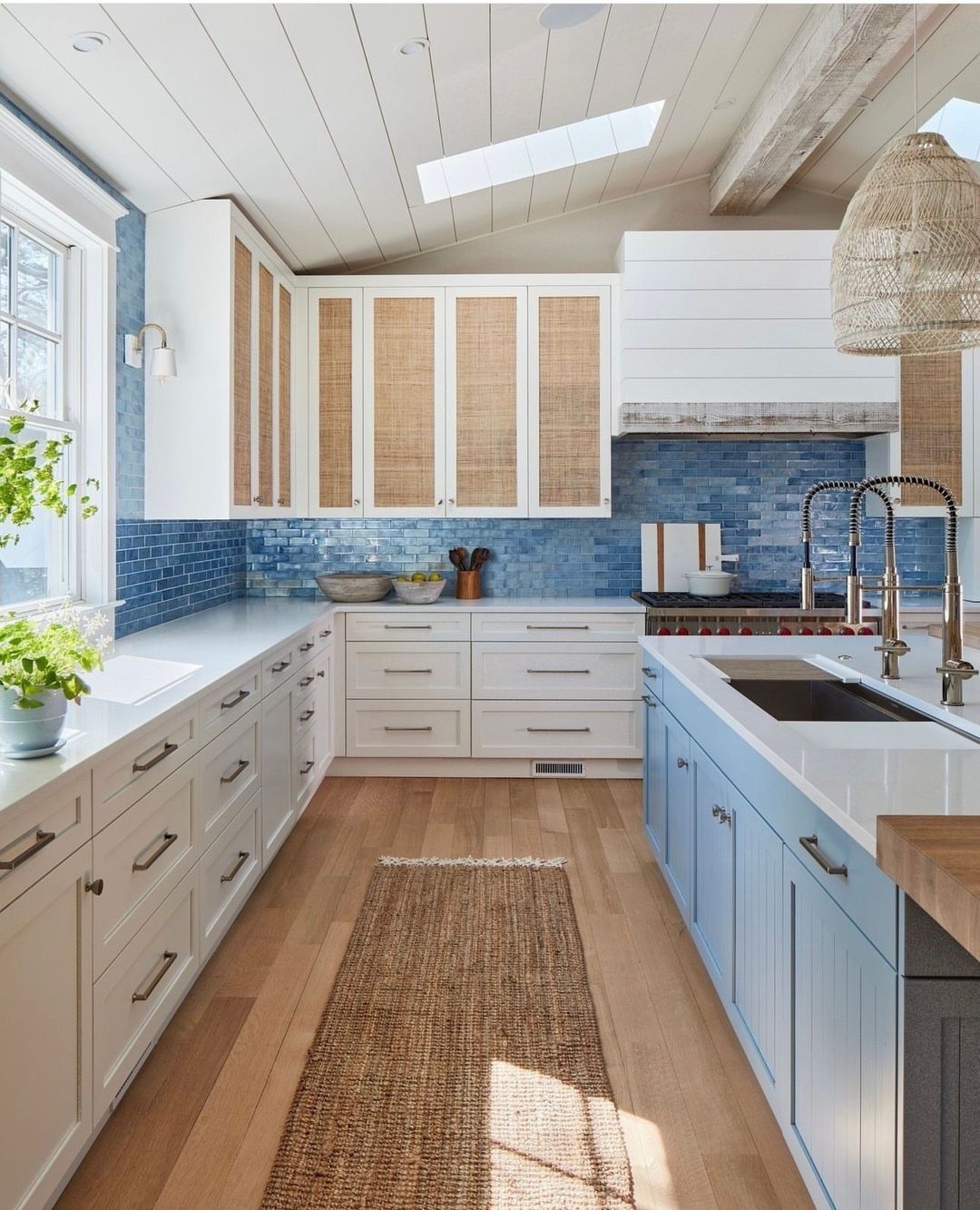 A cozy, beach-style kitchen featuring ocean blue backsplash tiles