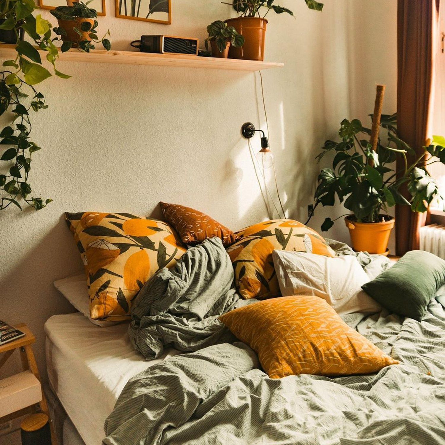 A cozy bedroom corner with a snug arrangement of pillows