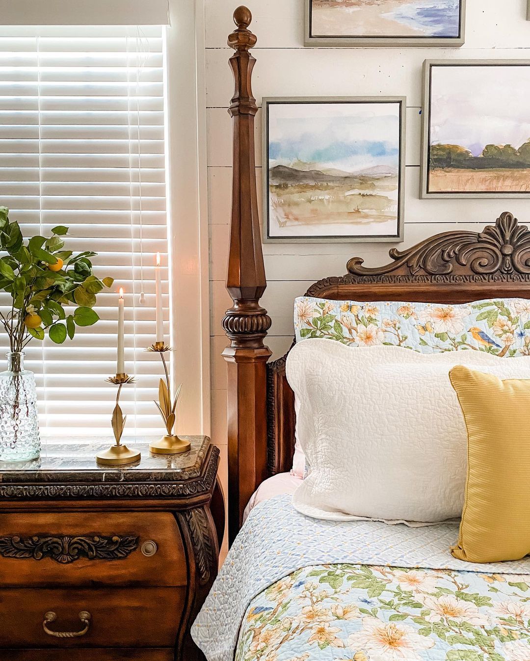 A cozy bedroom corner showcasing a classic four-poster bed and a nightstand with decorative items