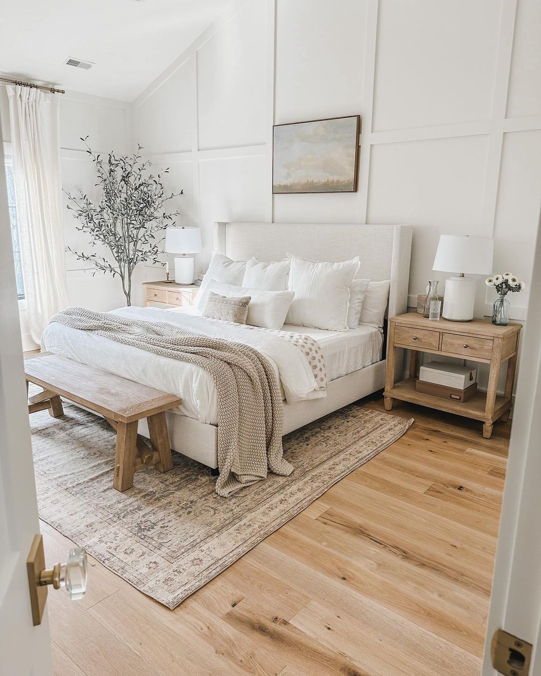 A serene and well-organized bedroom featuring harmonized textures and subtle tones.