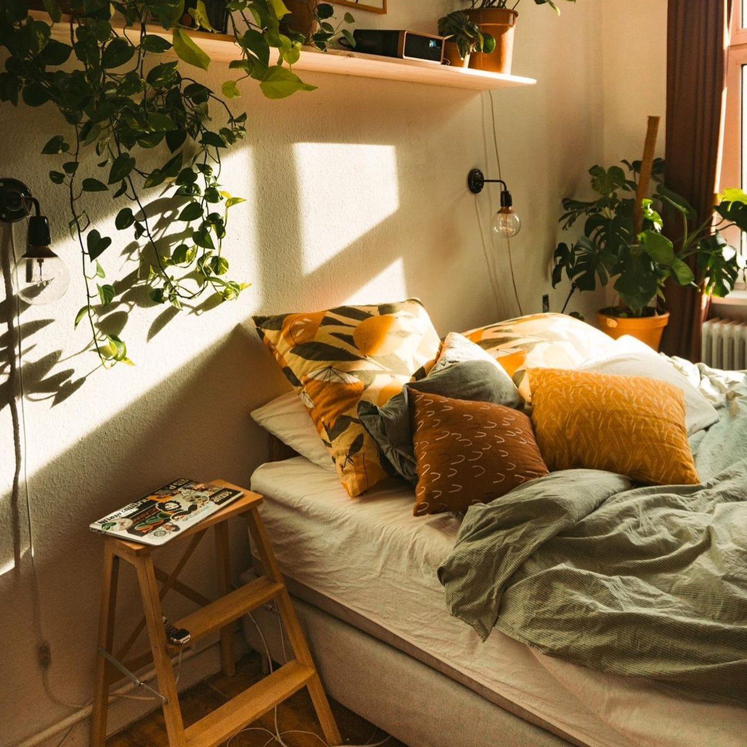 Cozy bedroom with sunlight filtering through greenery