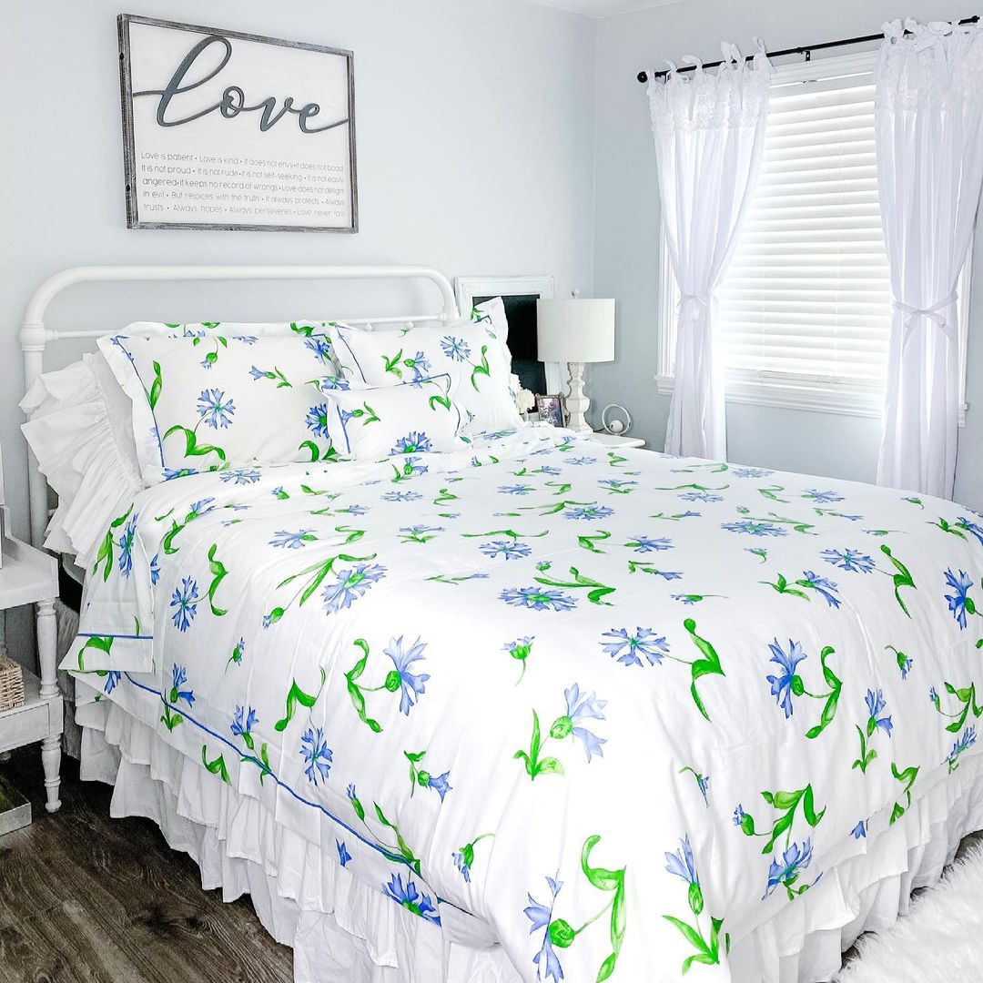 A serene bedroom with a floral bedspread