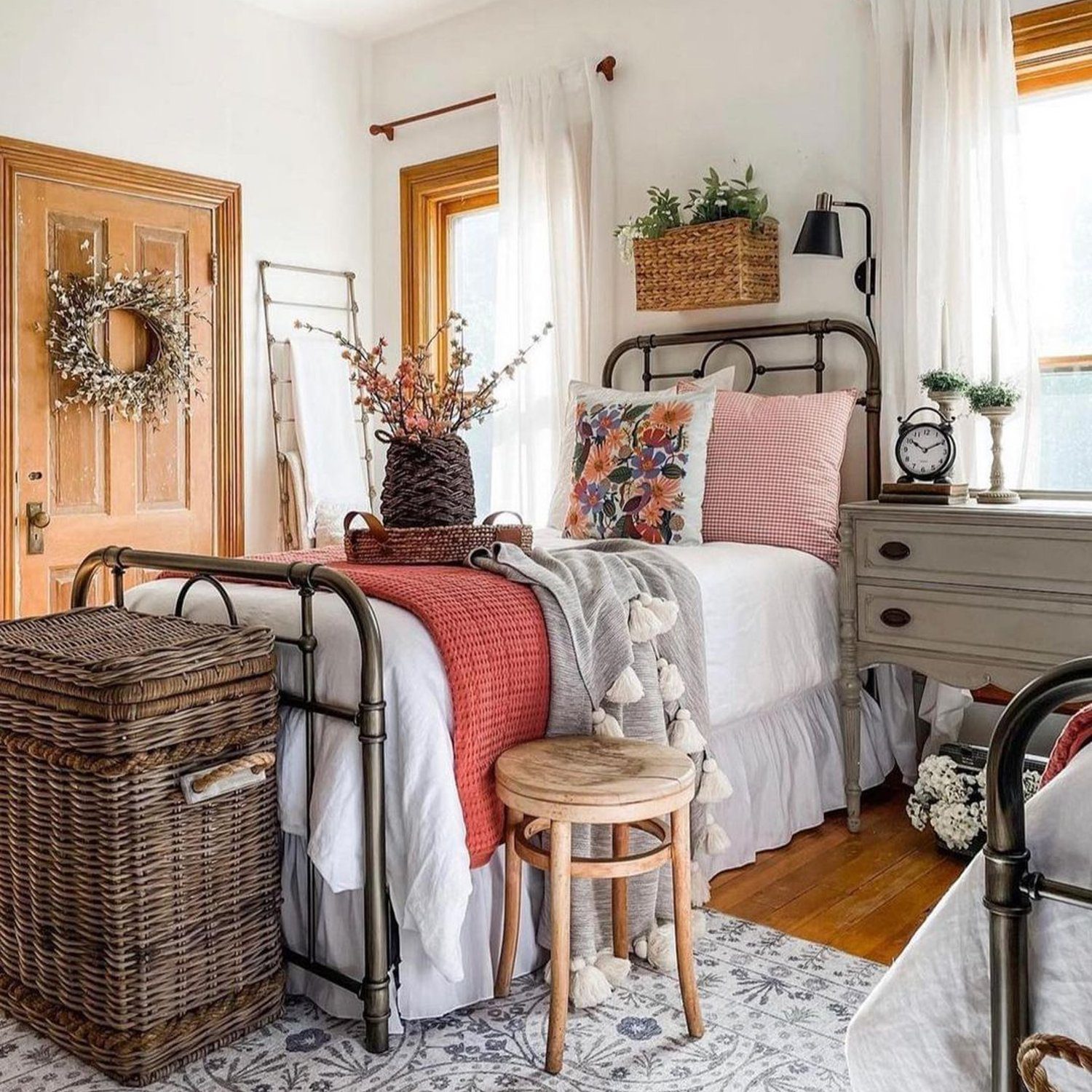 A cozy, inviting bedroom featuring a mix of textures and warm tones