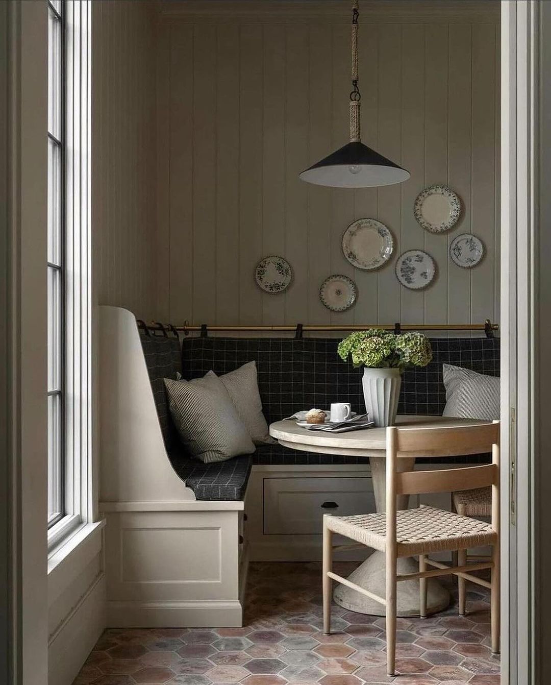 Cozy corner nook with cushions and natural light