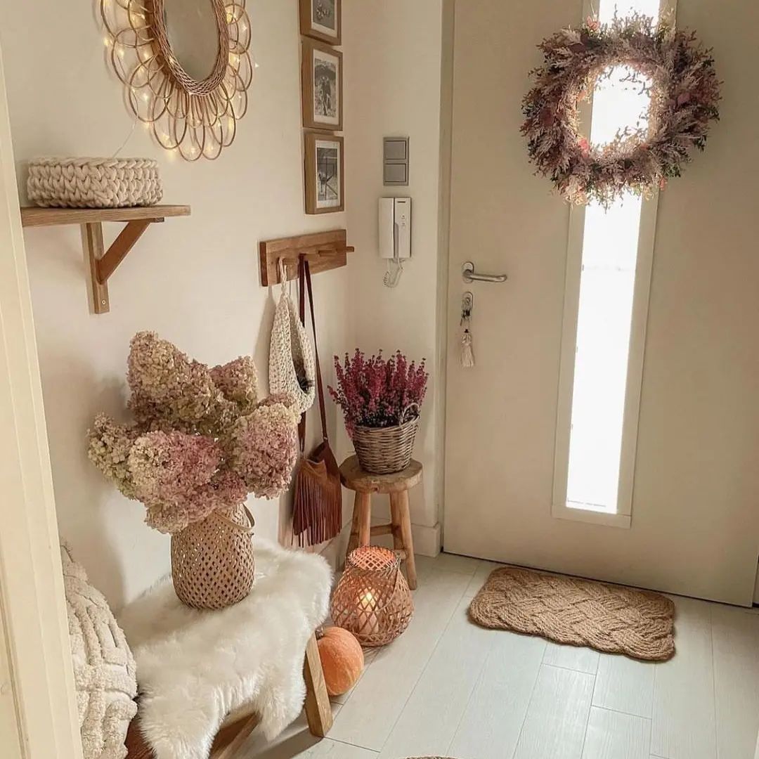 A cozy and inviting entryway featuring a textural contrast of dried hydrangeas and heather