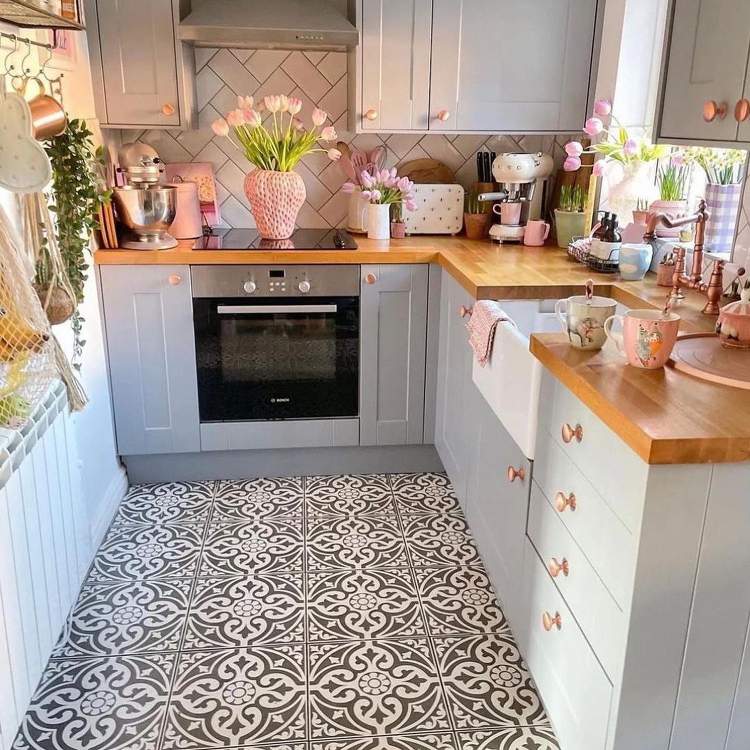 A quaint and charming kitchen with a harmonious blend of pastel tones and wooden accents.