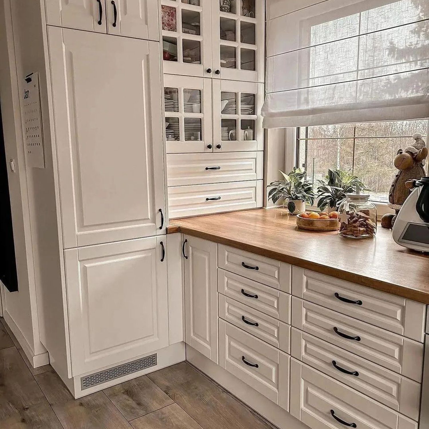 A cozy kitchen corner with natural light spilling in through the window