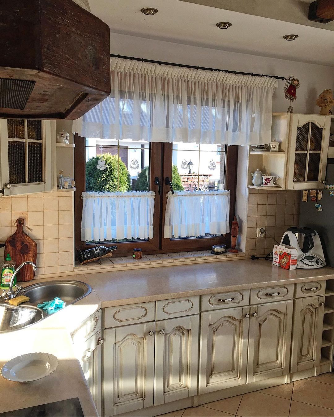 A quaint and rustic kitchen space that boasts a sense of comfort and warmth.