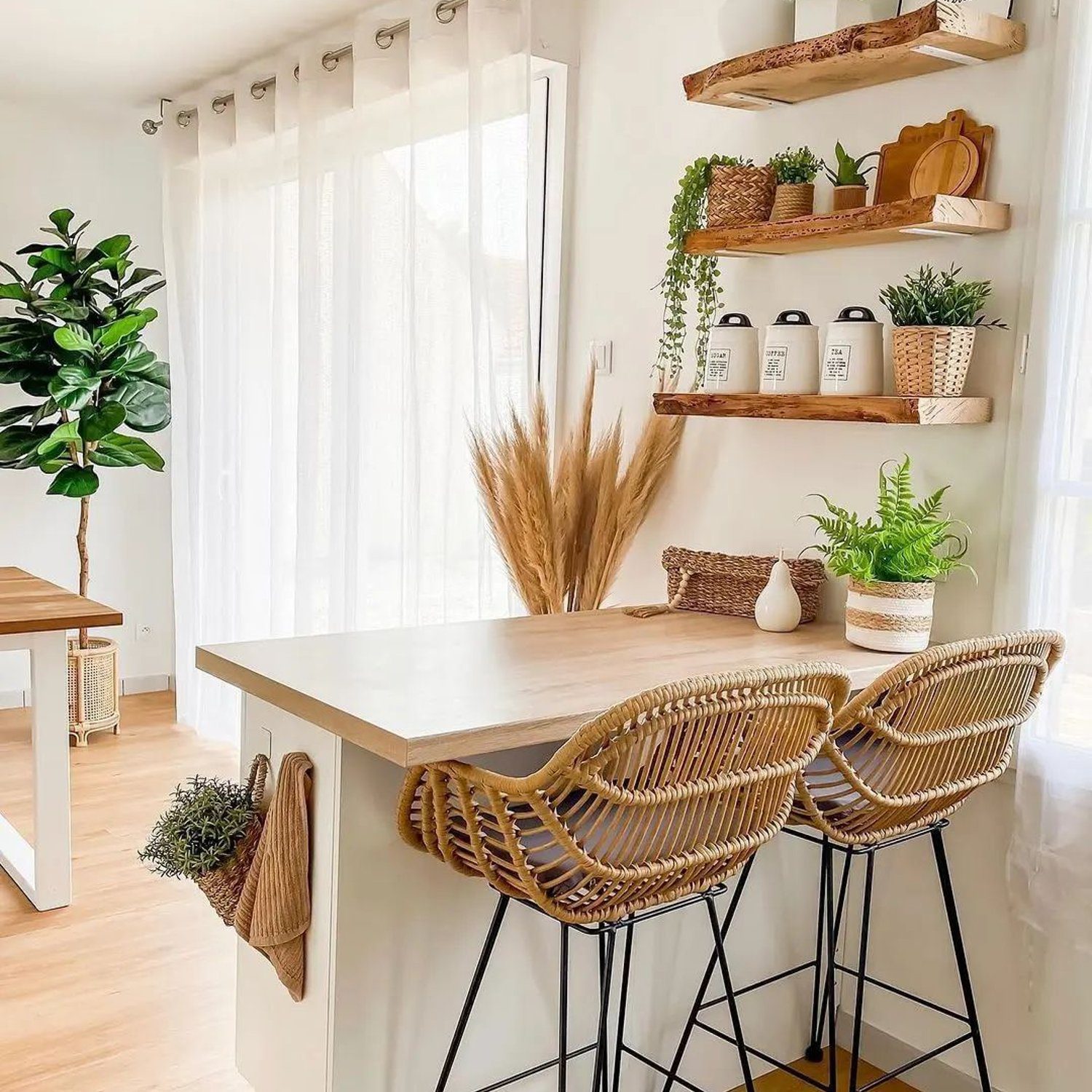 A bright and inviting kitchen corner featuring wicker bar stools and rustic wooden shelves