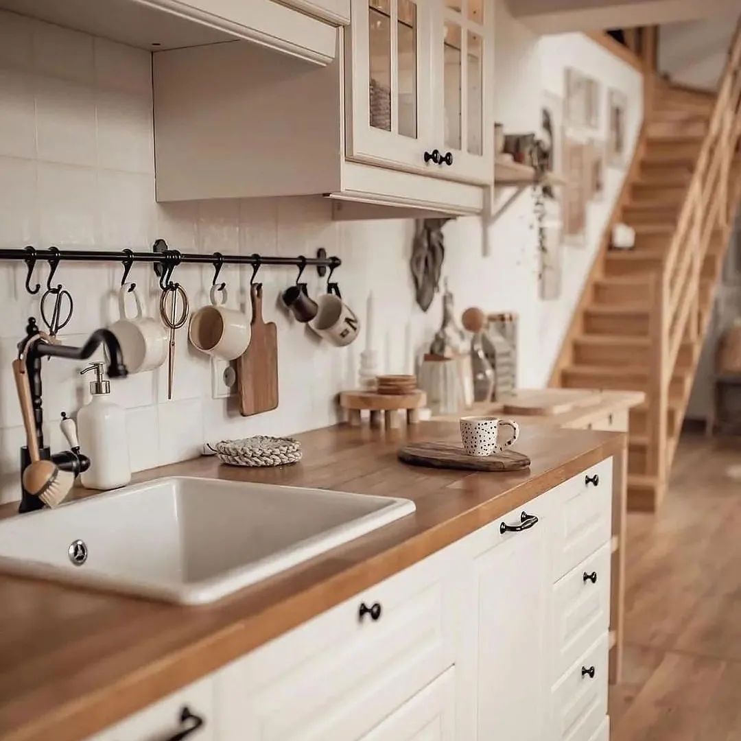 A cozy and inviting kitchen space featuring wooden countertops and rustic accents