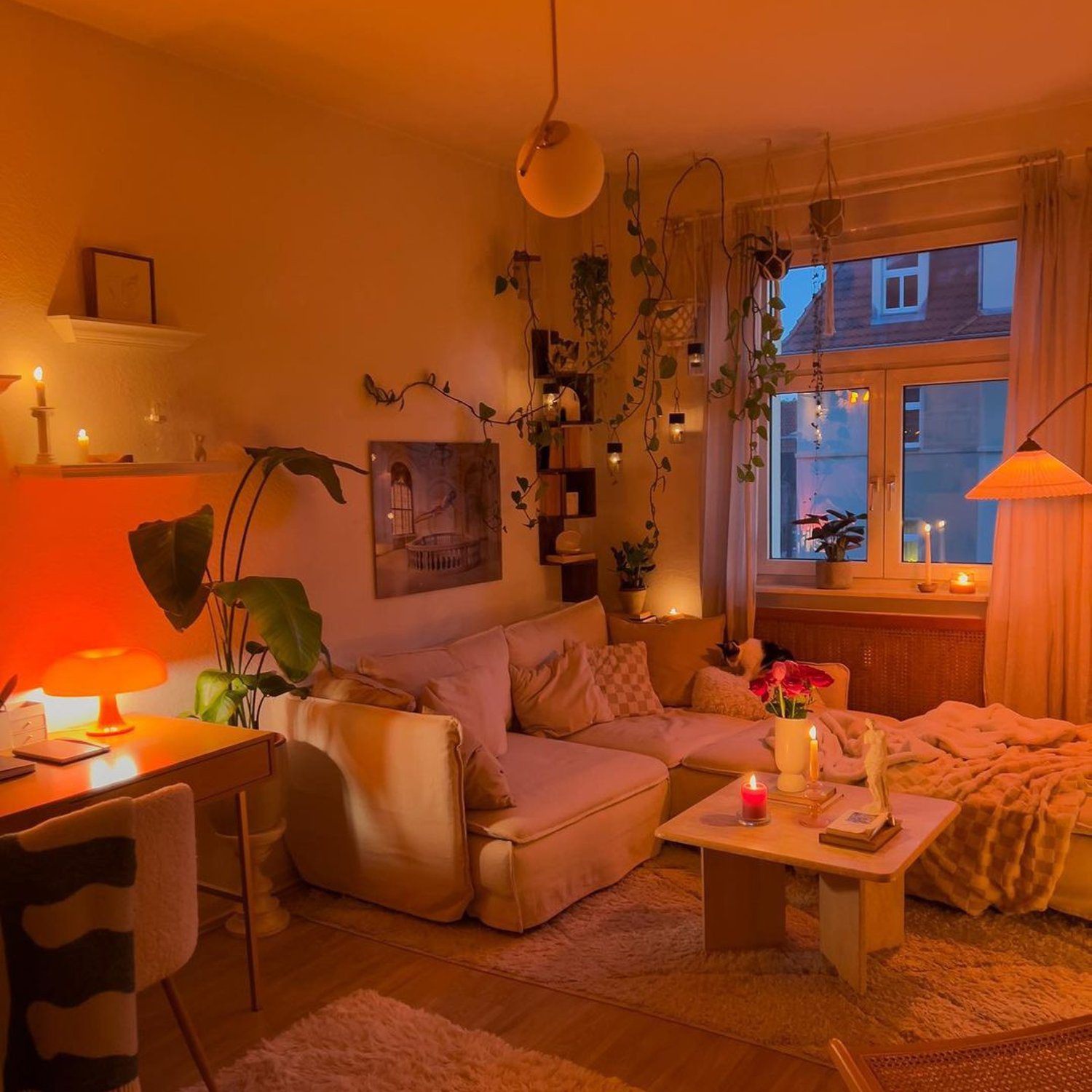 Cozy evening atmosphere in a well-decorated living room with warm lighting