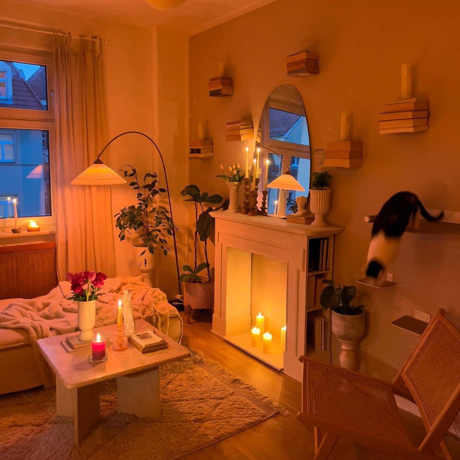 A cozy living room with warm lighting and a cat in motion