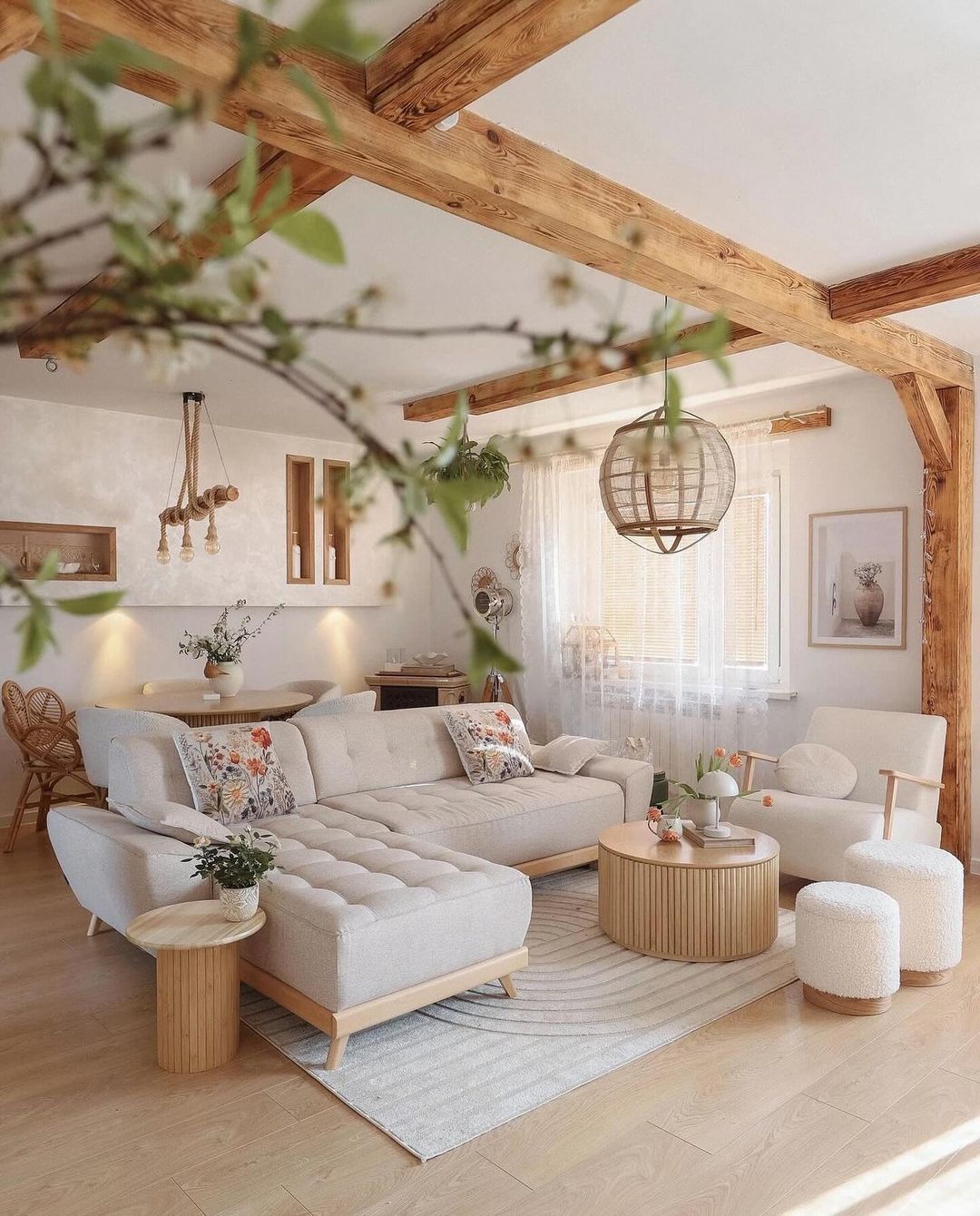 A cozy living room with exposed wooden beams