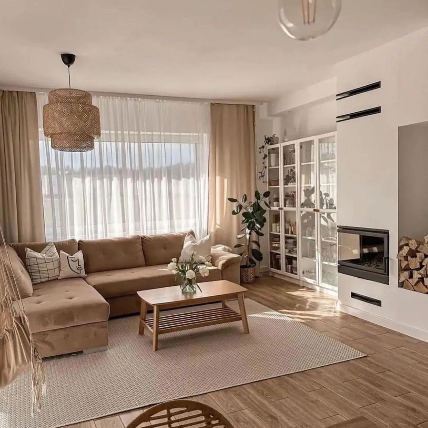 A warm and inviting living room with ample natural light and cozy decor.