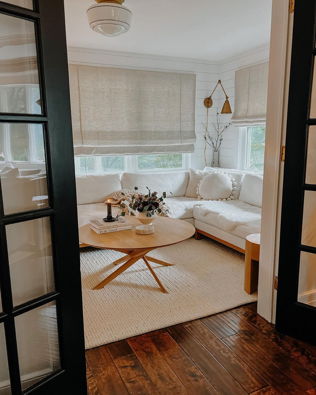 A cozy and inviting living room with warm natural lighting