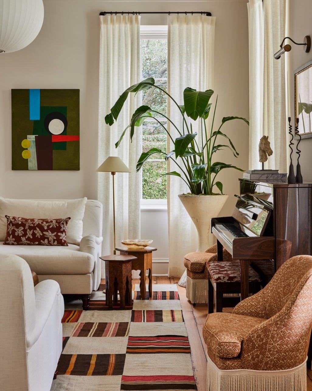 Cozy living room with a mix of textures and a grand piano