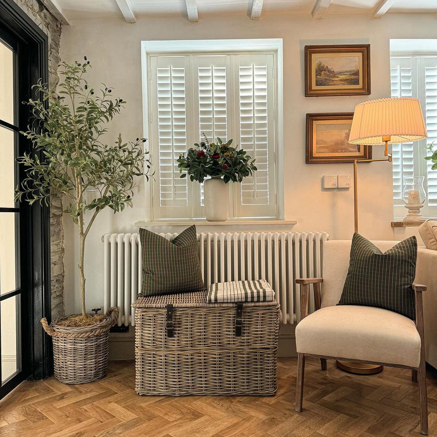 Cozy interior design of a living room with herringbone-patterned wooden floor