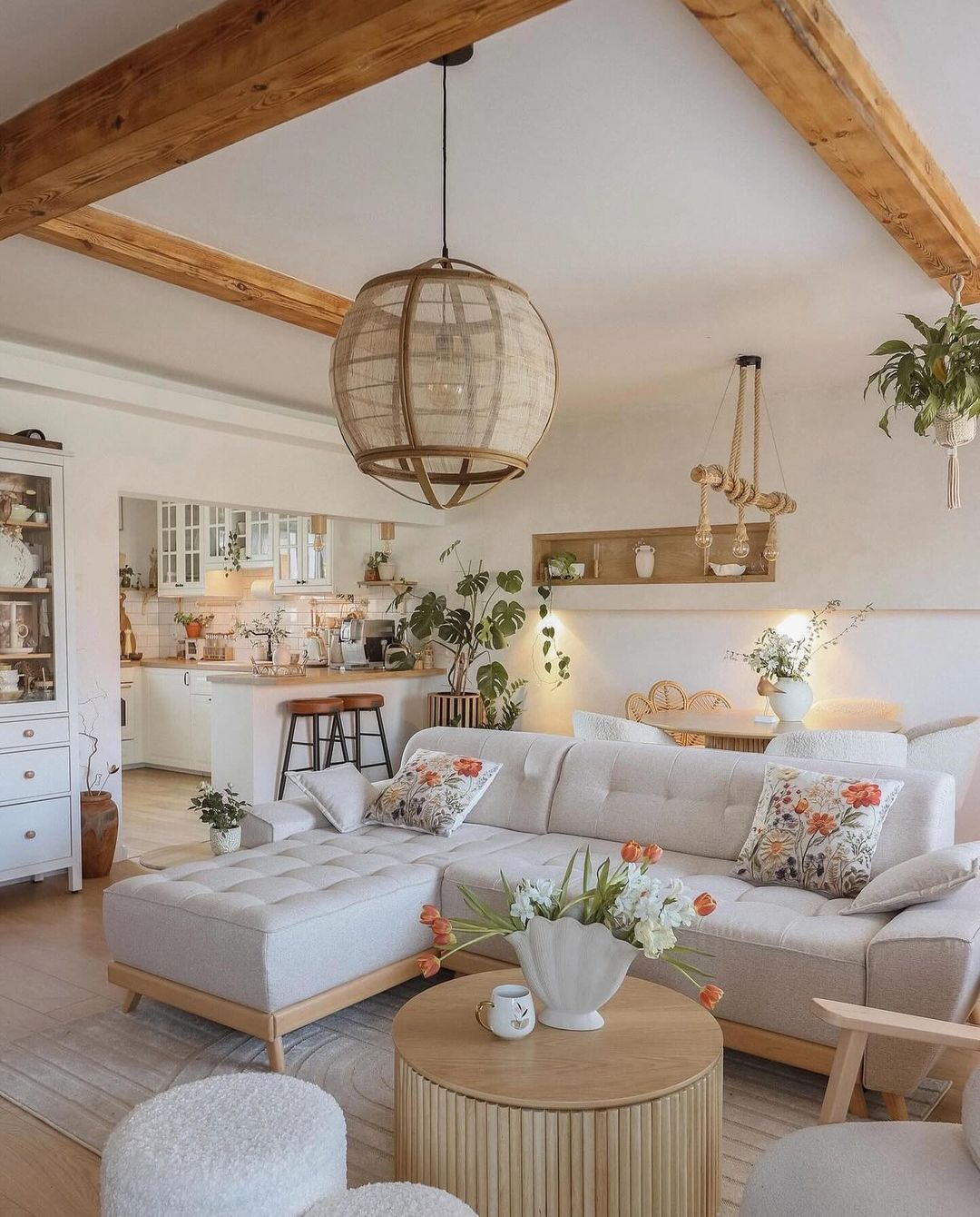 A cozy and well-appointed living room with exposed wooden beams