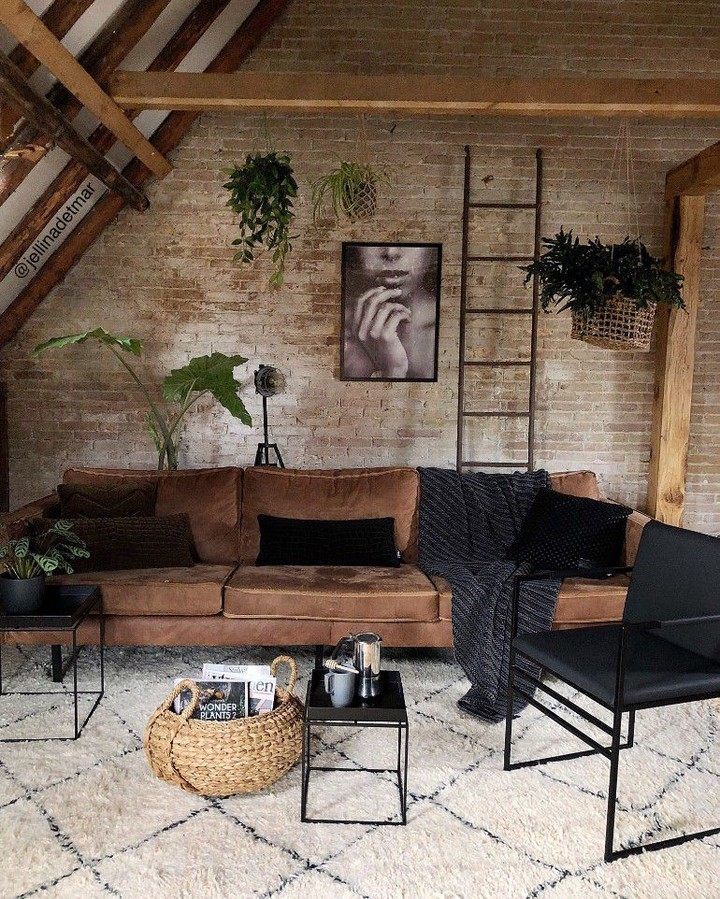 Cozy and rustic loft-style living room with exposed brick walls