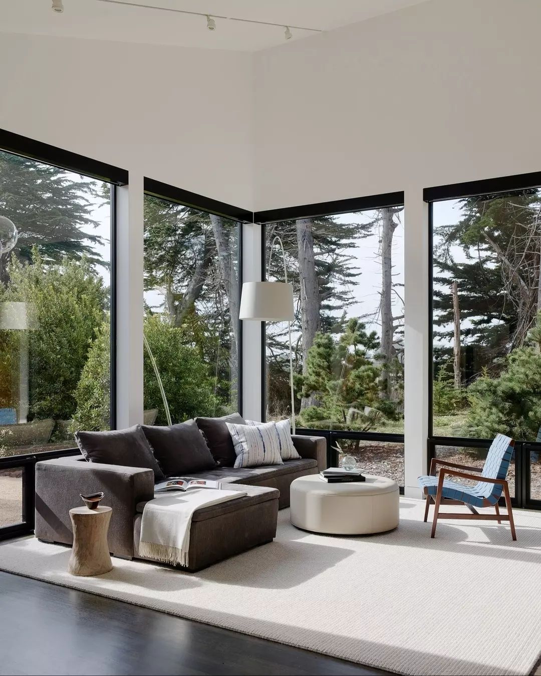 A cozy modern living room with panoramic windows