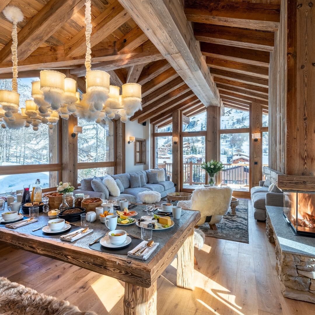 A cozy mountain chalet interior with a breakfast table set